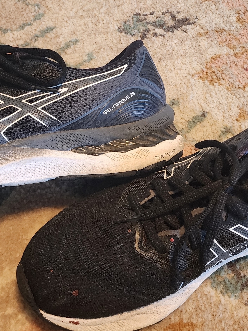 Women's Asics Black and White Gel Nimbus 23.